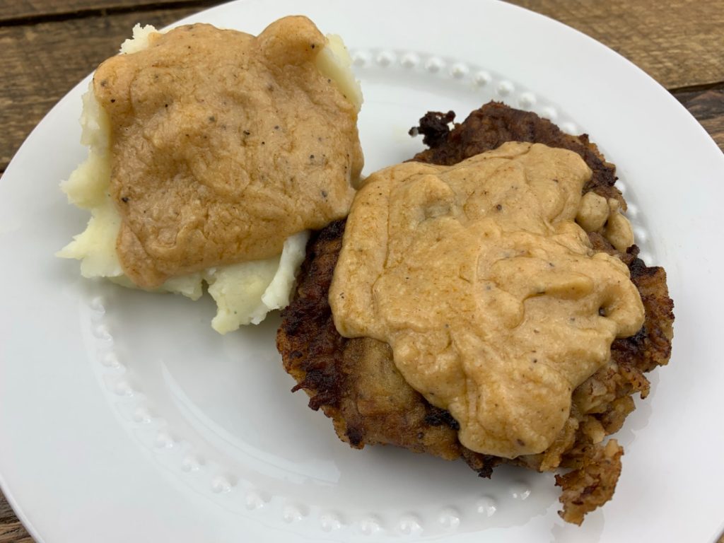 chicken fried steak and gravy with mashed potatoes