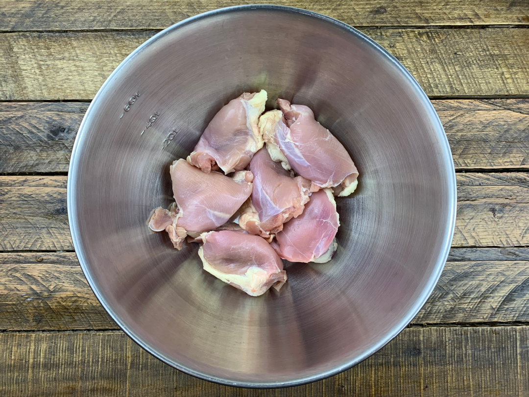 raw chicken thighs in a bowl