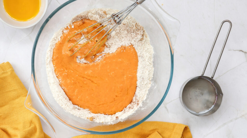Pumpkin mixture being combined with dry ingredients for pumpkin pancakes