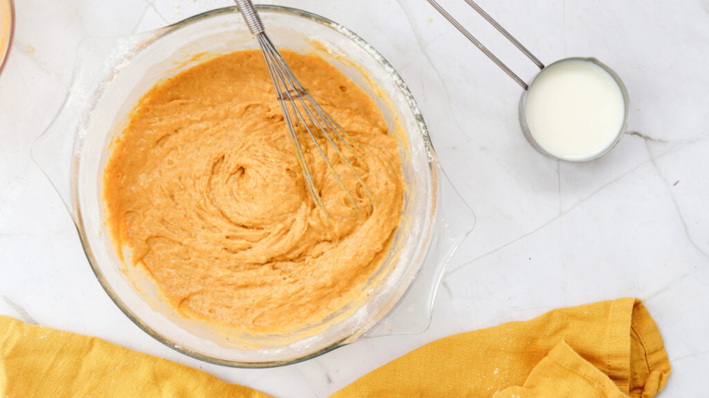 Thick homemade pumpkin pancake batter mixed and ready to cook