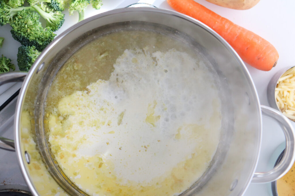 Heavy cream added to homemade Broccoli Cheddar Soup after the vegetables have finished simmering.