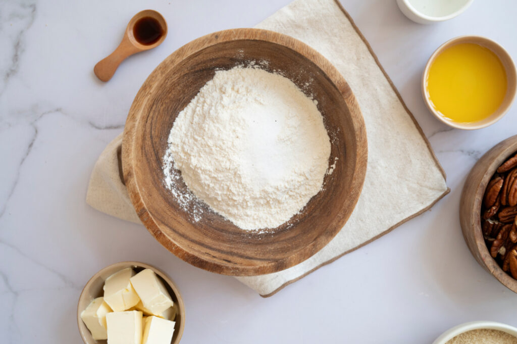 All-purpose flour and salt in a mixing bowl for making the homemade crust for classic pecan pie.
