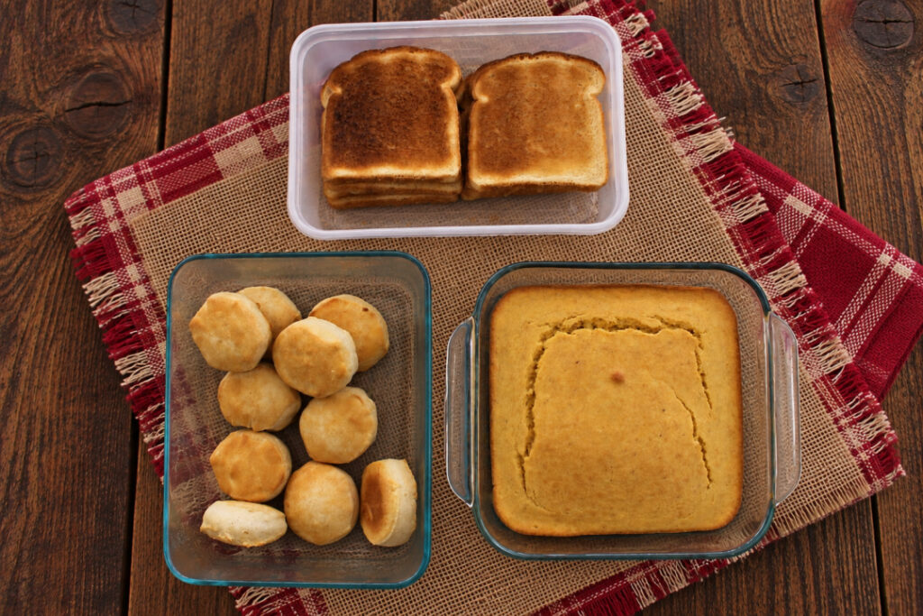 Cornbread, biscuits, and toasted bread prepared for making Southern cornbread dressing.